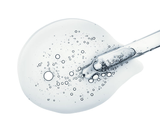 clear liquid with a glass pipette depicting Biosomes derived from Exosomes in skincare Brightener uses stem cell-derived exosomes used to brighten and restore skin at a cellular level