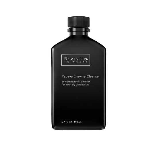 Black bottle of Revision Skincare Papaya Enzyme Cleanser on a white background for oily and combination skin